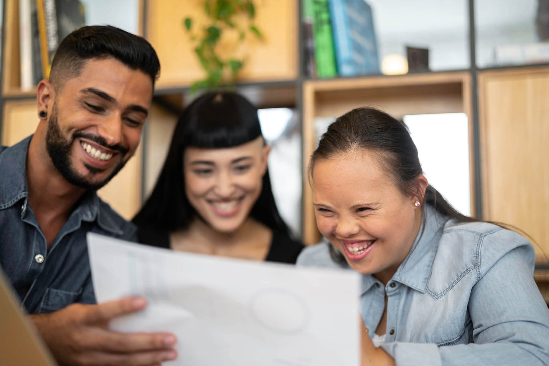 Three people working together